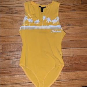 Yellow graphic bodysuit.